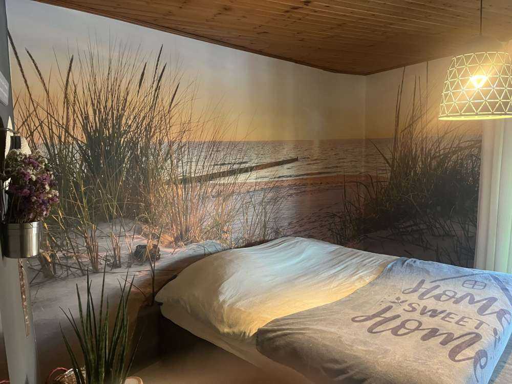 Duinstrand met zonsondergang