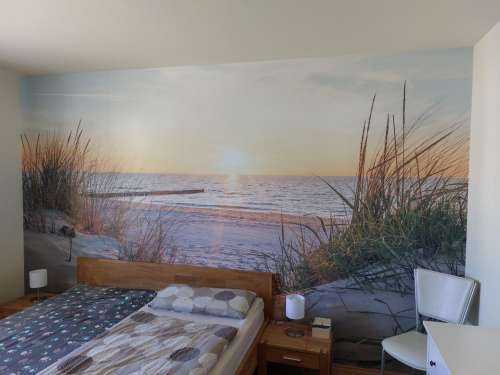 Duinstrand met zonsondergang