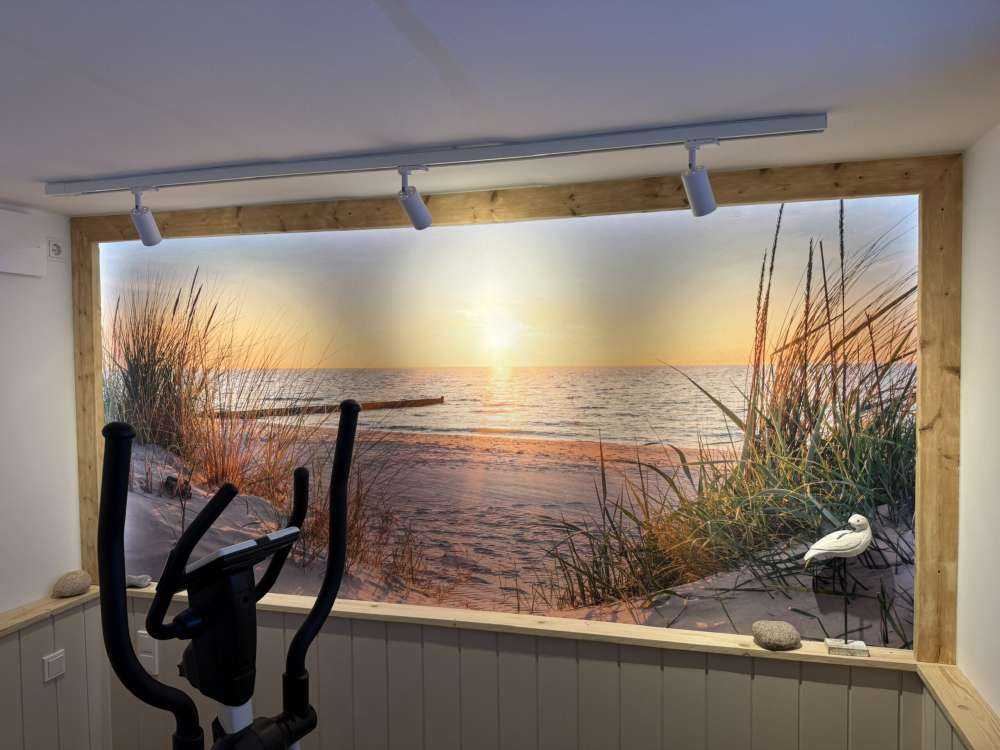 Duinstrand met zonsondergang