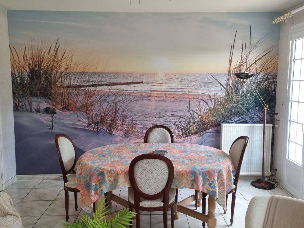 Duinstrand met zonsondergang