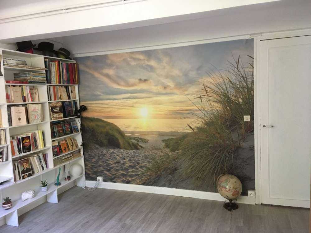 Zonsondergang aan duinstrand