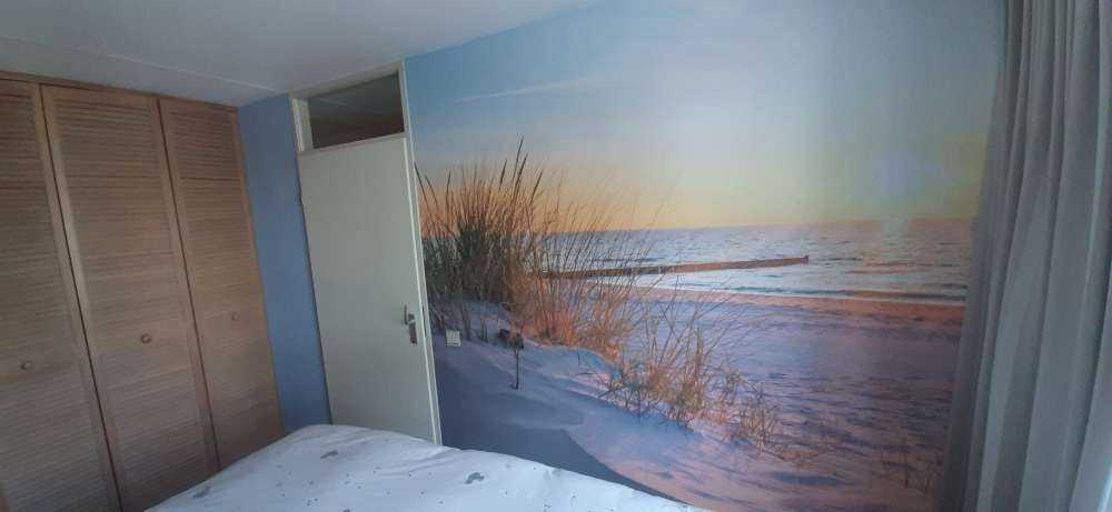 Duinstrand met zonsondergang