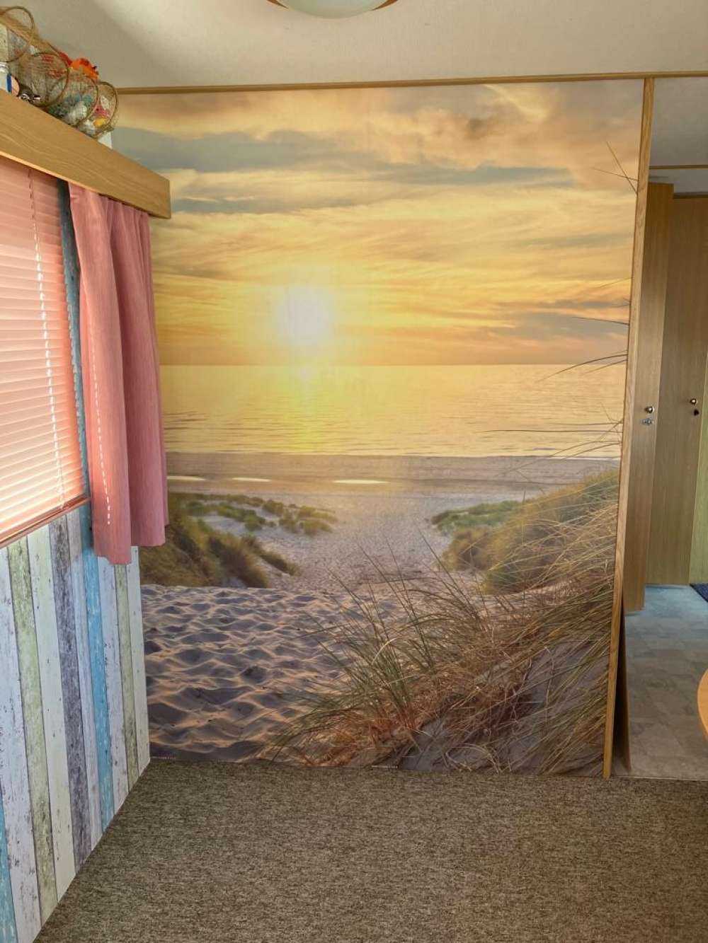 Zonsondergang aan duinstrand