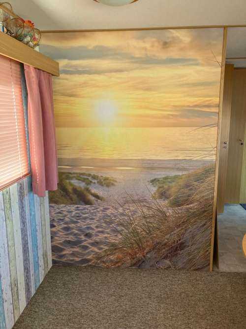 Zonsondergang aan duinstrand