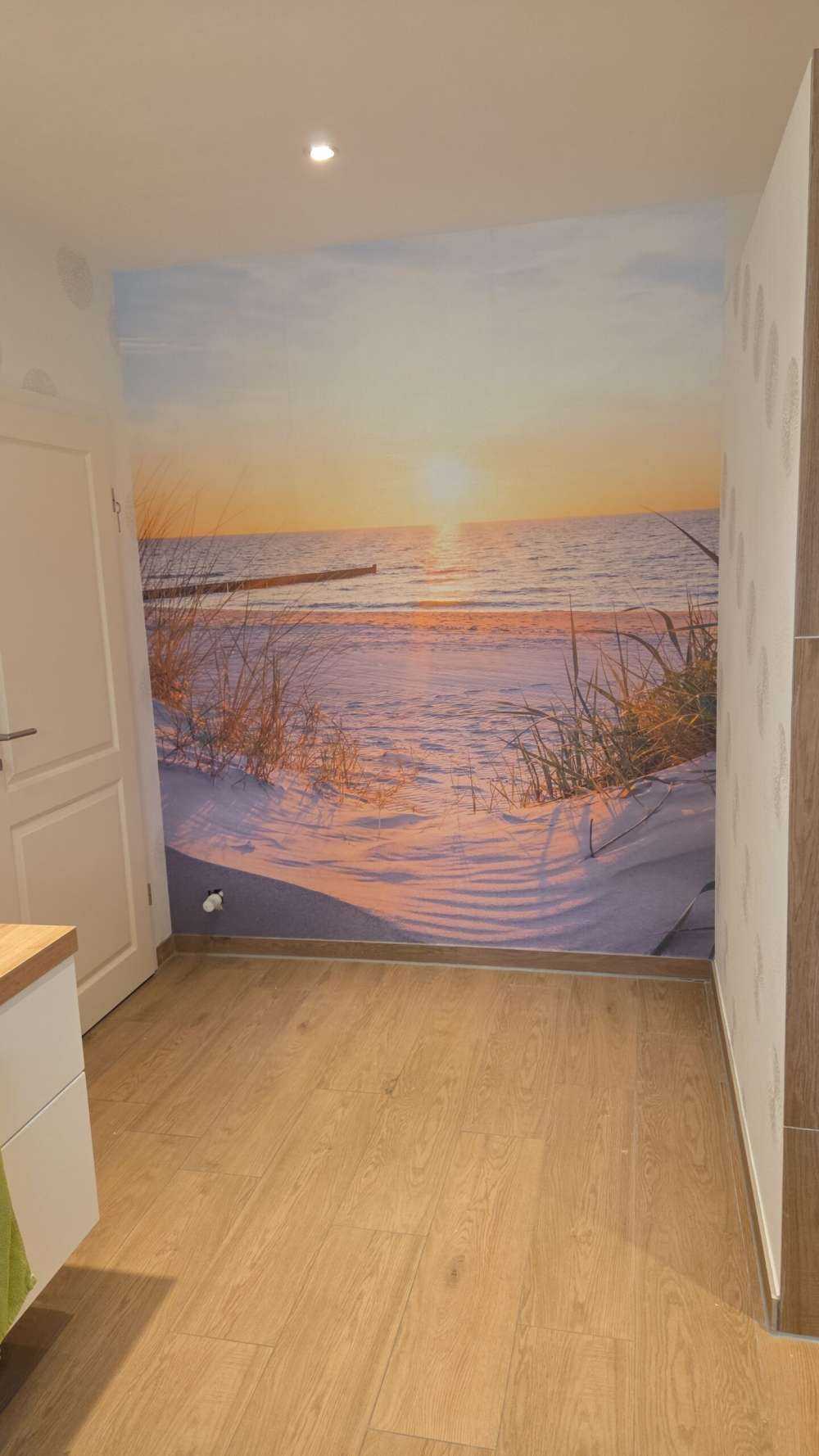 Duinstrand met zonsondergang
