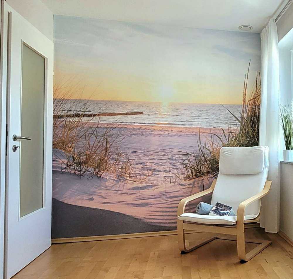 Duinstrand met zonsondergang