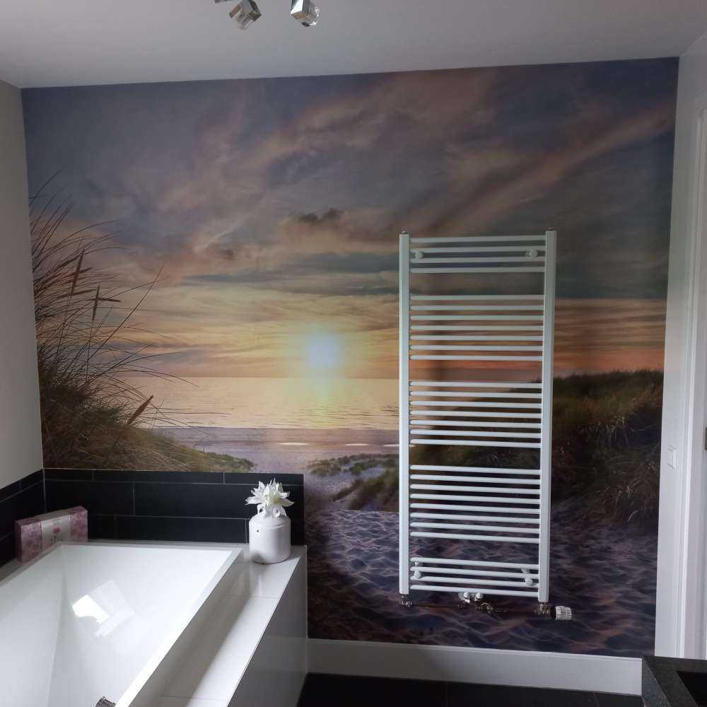 Zonsondergang aan duinstrand