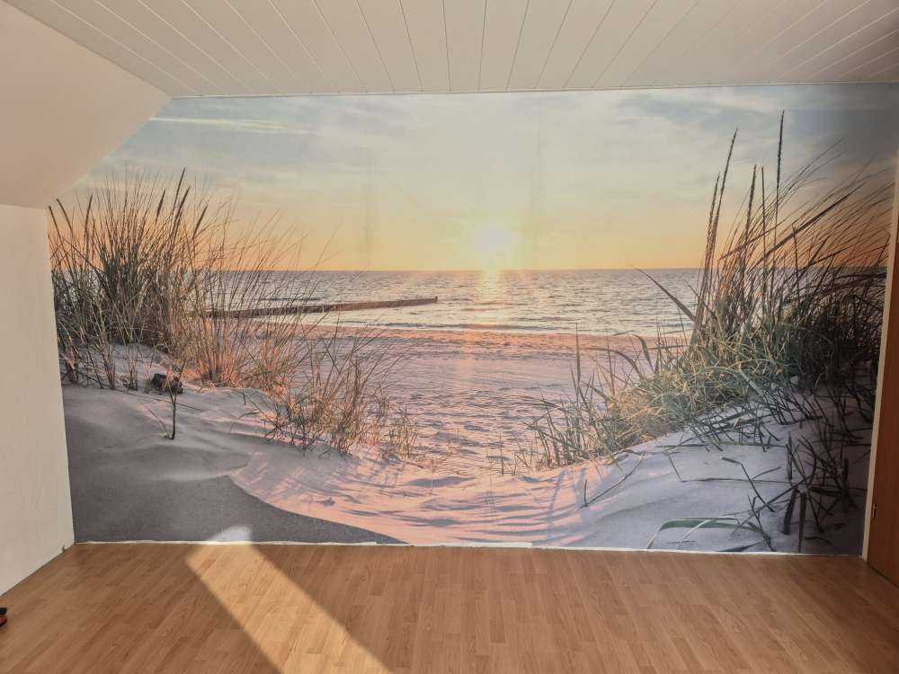 Duinstrand met zonsondergang