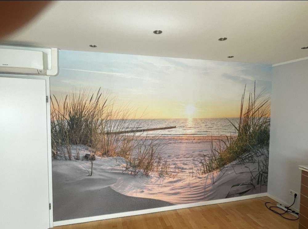 Duinstrand met zonsondergang