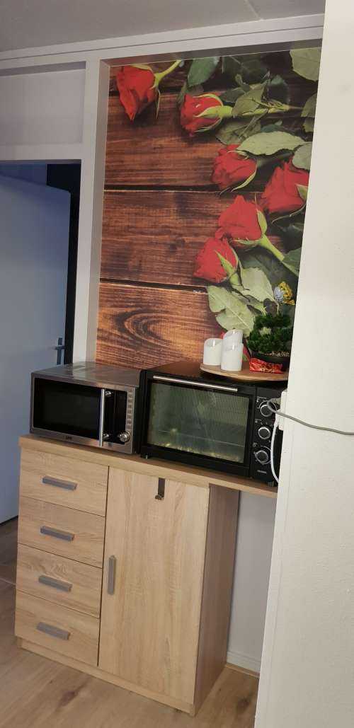 Rode rozen op hout