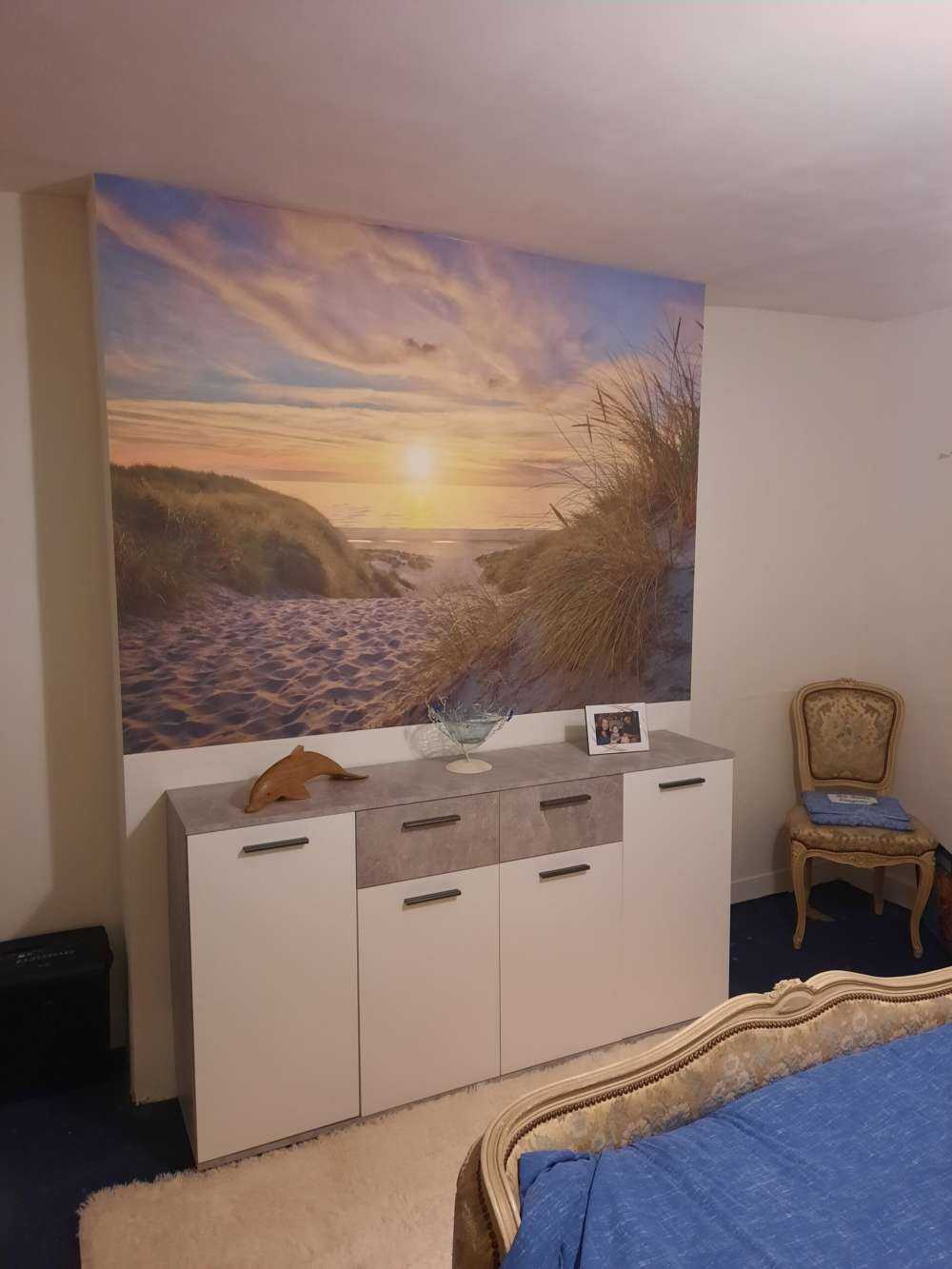 Zonsondergang aan duinstrand