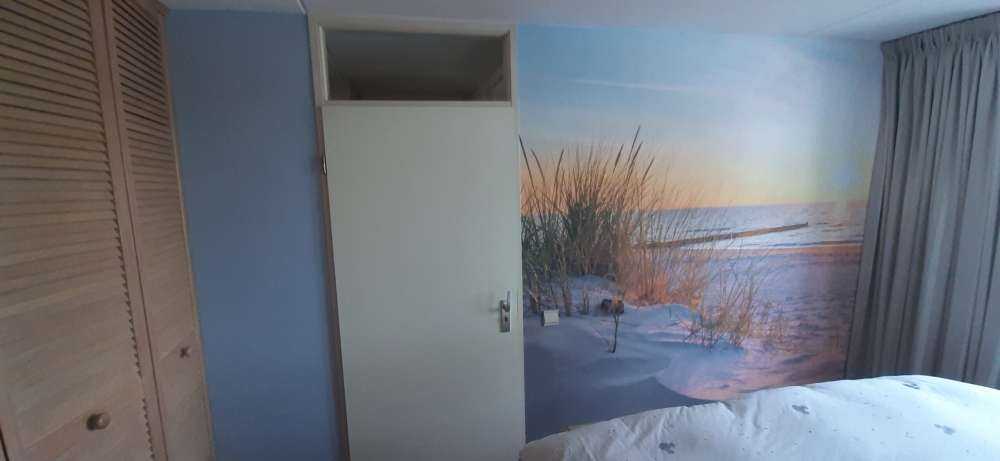 Duinstrand met zonsondergang