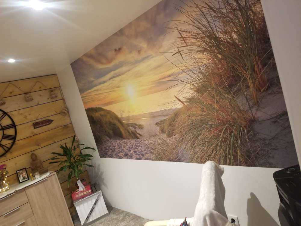 Zonsondergang aan duinstrand