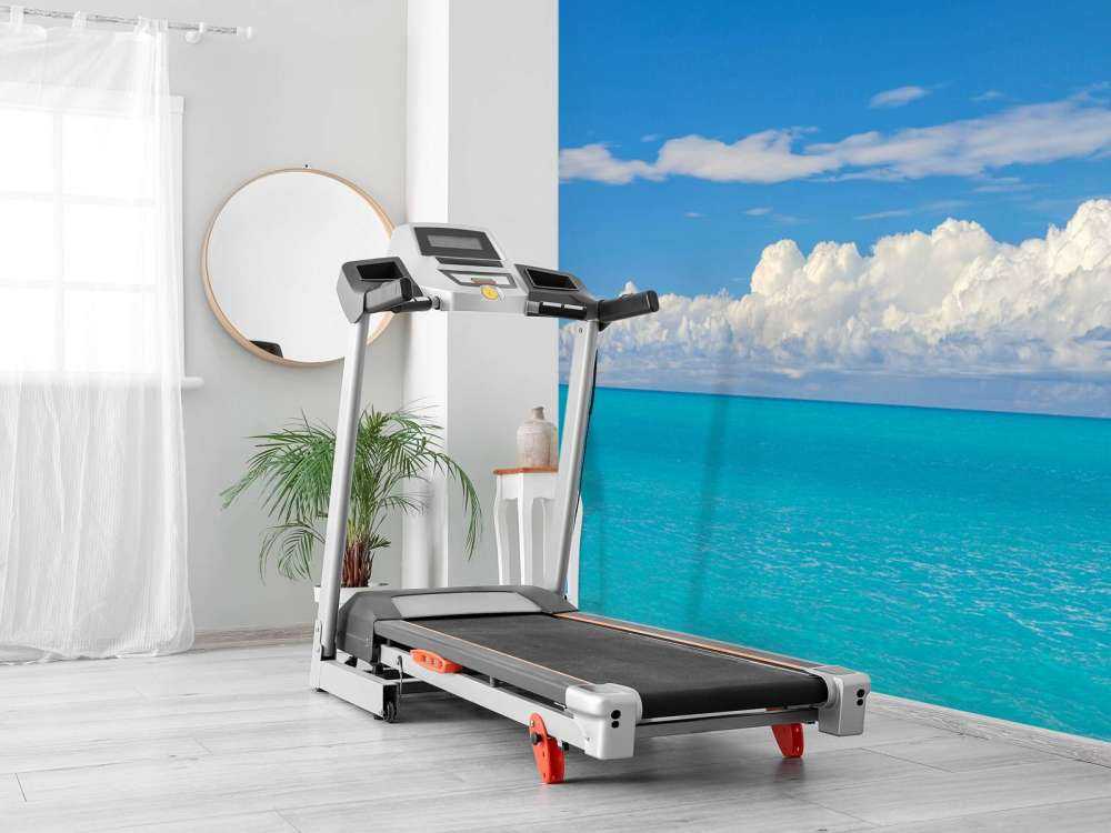 Panoramic view of a blue seascape with sailboat and cloudy sky