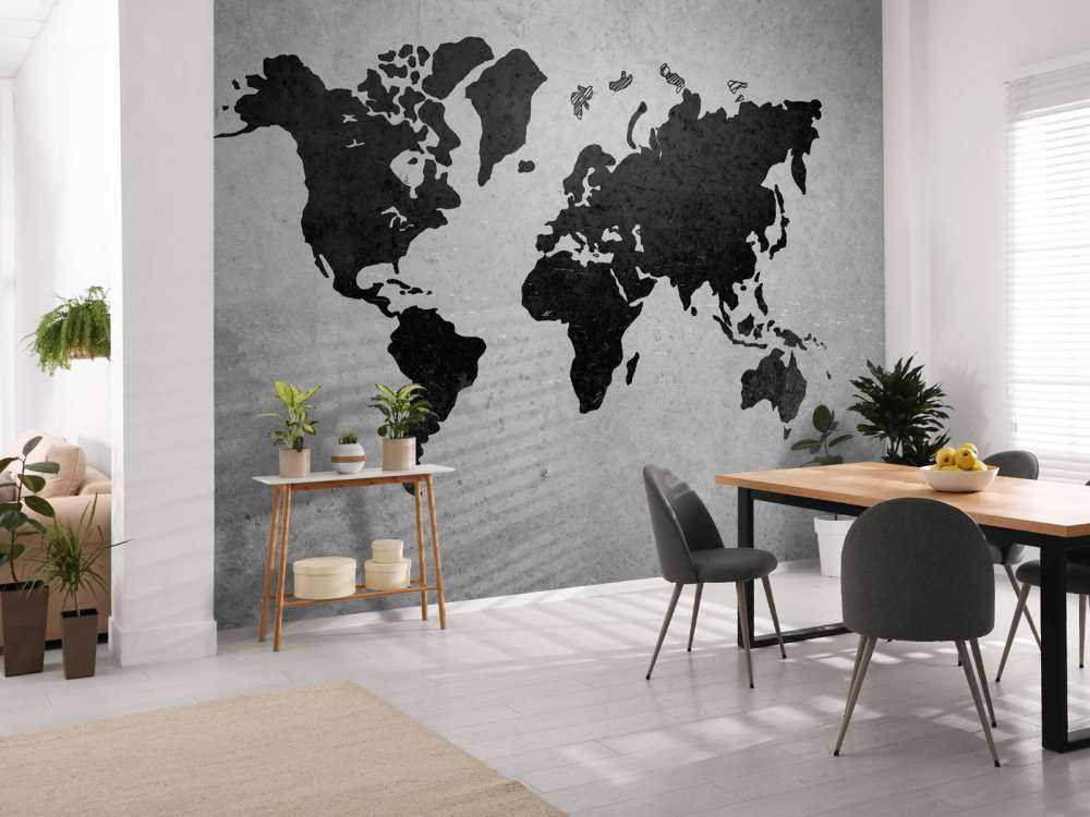 Zwarte wereldkaart op een betonnen muur