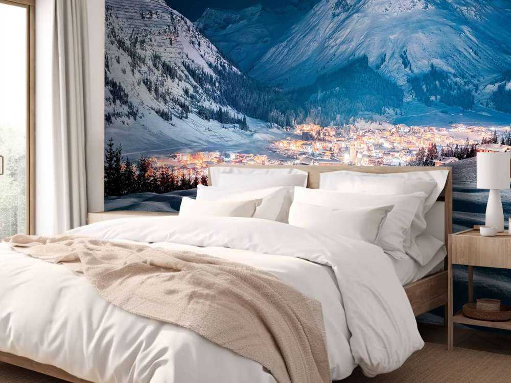 Winterdorp onder maanlicht in alpenvallei