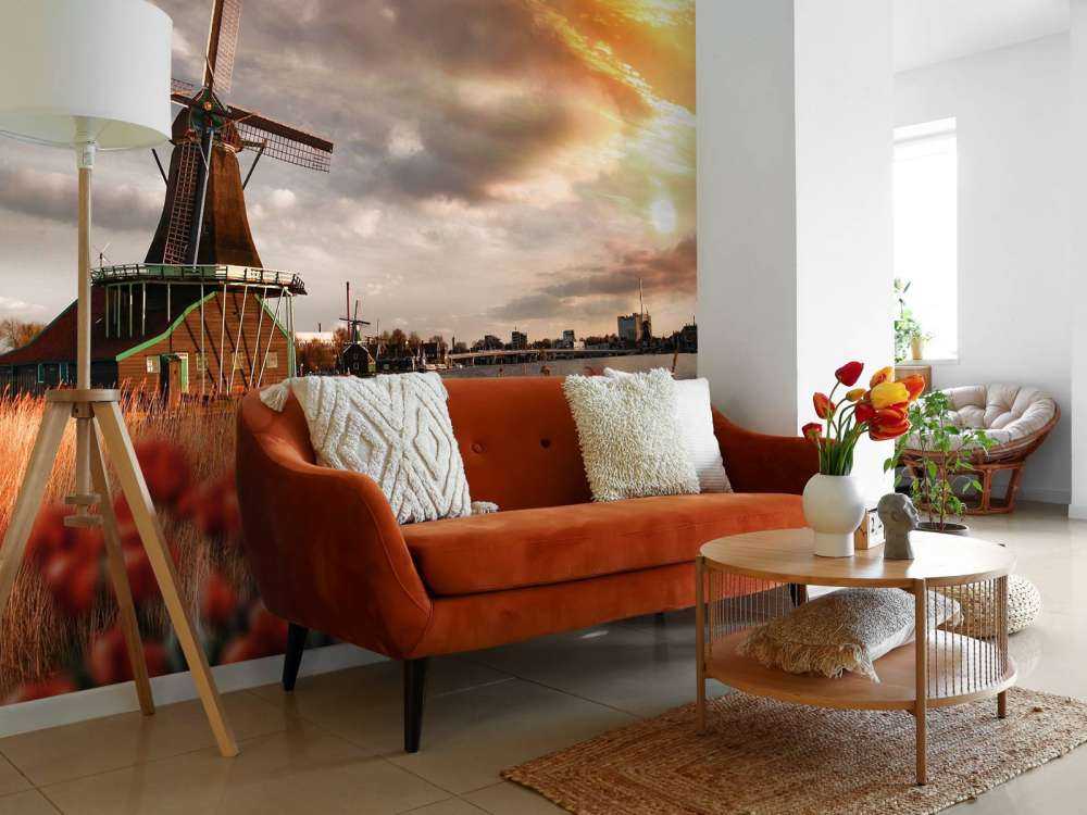 Hollands landschap met molen bij zonsondergang