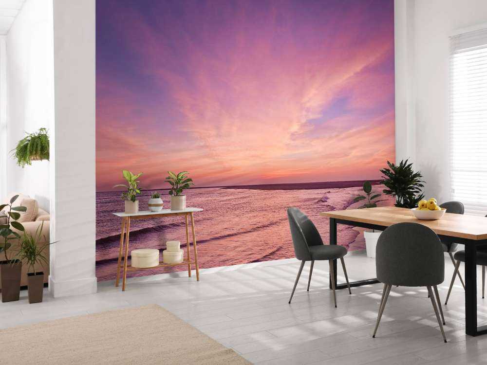 Strand met roze zonsondergang