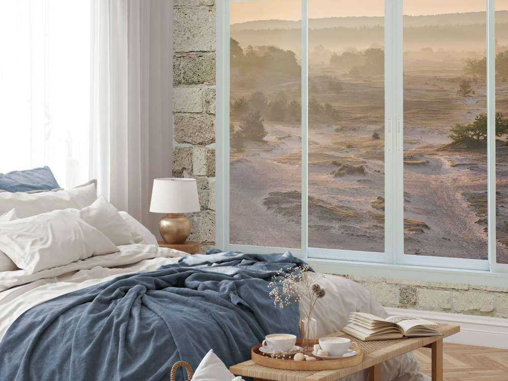 Zandverstuiving in ochtendmist