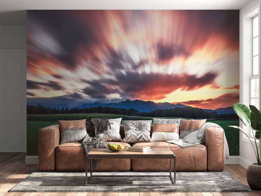 Zonsondergang boven groene vlakte