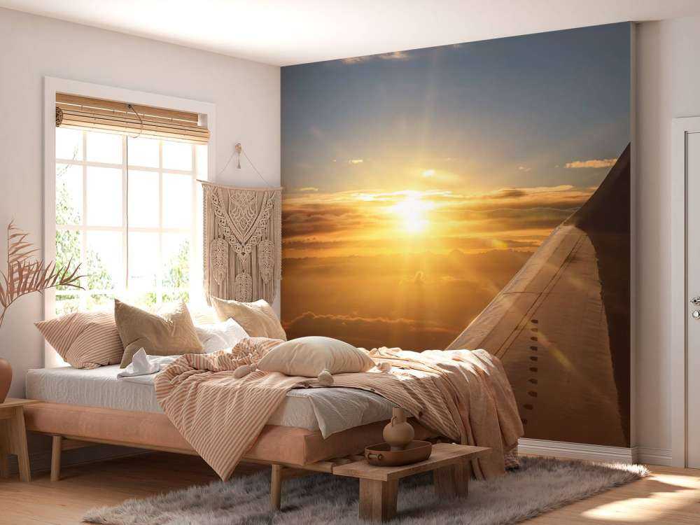 Zonsondergang vanuit een vliegtuigraam