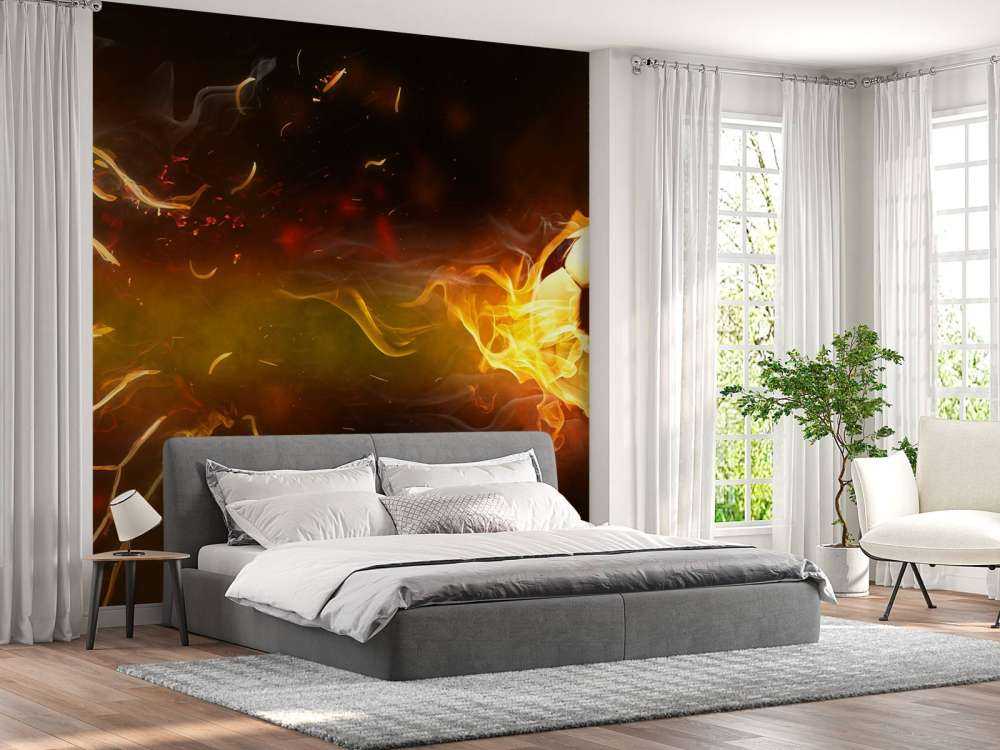 Voetbal brandt door het net