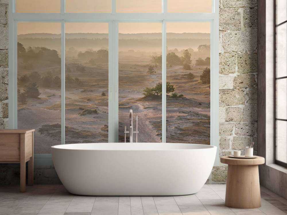 Zandverstuiving in ochtendmist