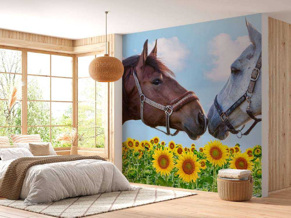 Liefdevolle paarden in een zonnebloemveld