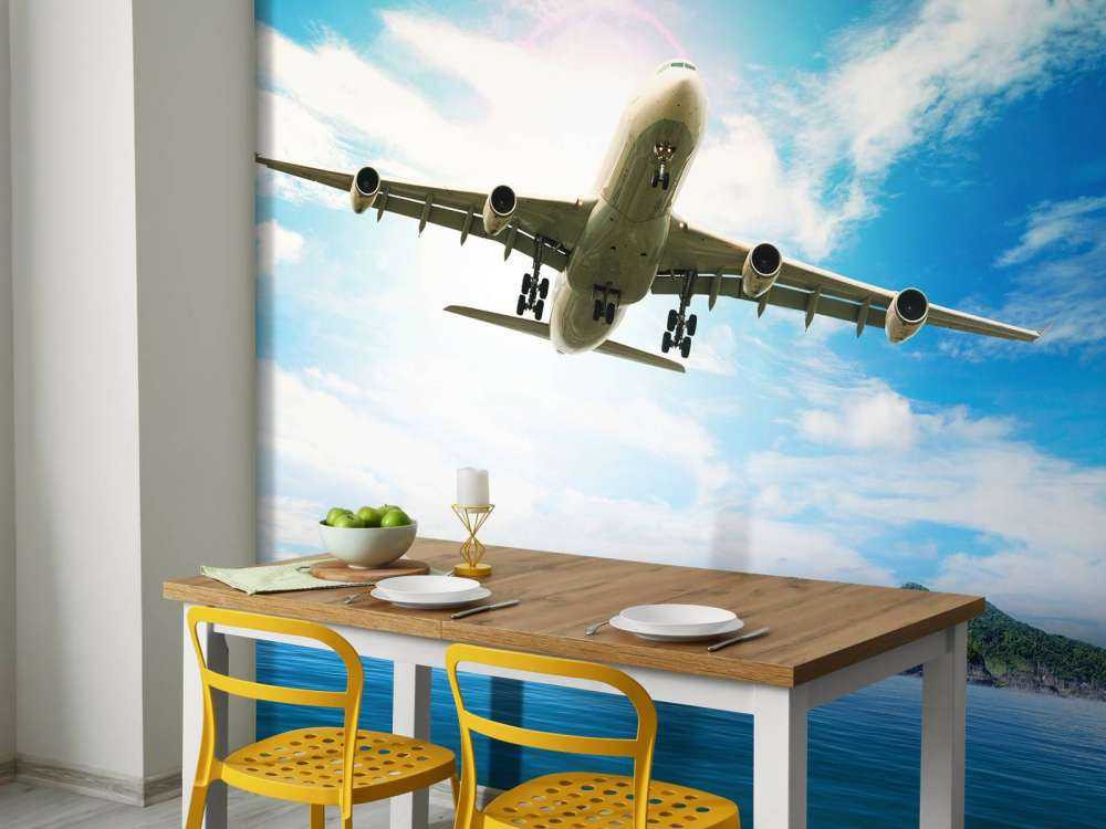 Passagiersvliegtuig boven een tropische zee