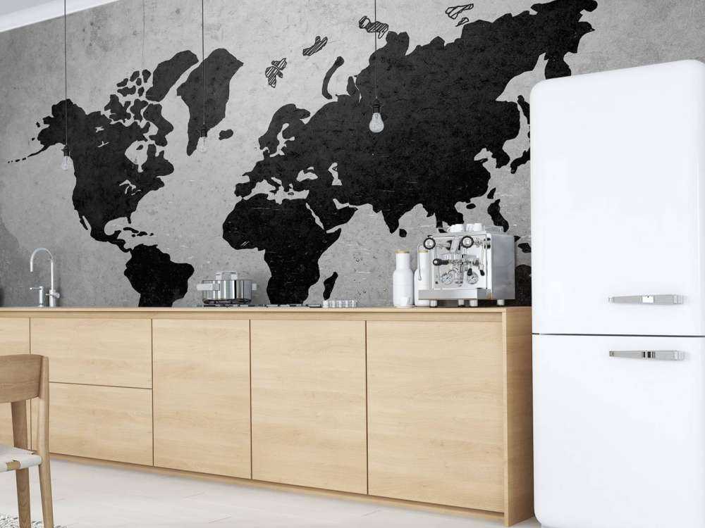 Zwarte wereldkaart op een betonnen muur