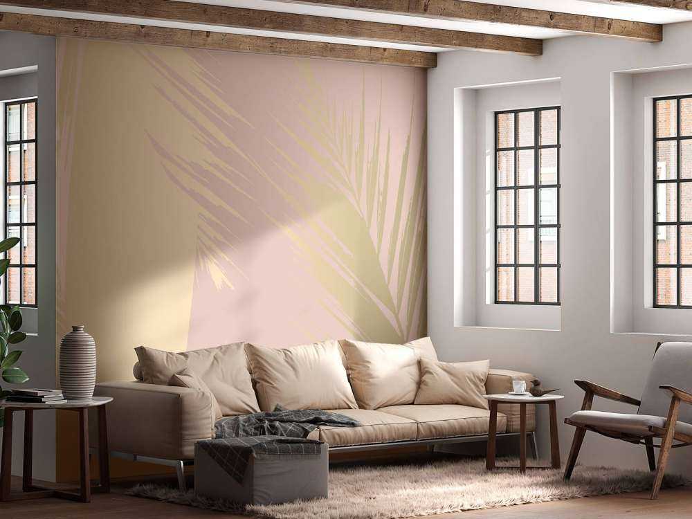 Gouden palmbladeren met een roze achtergrond