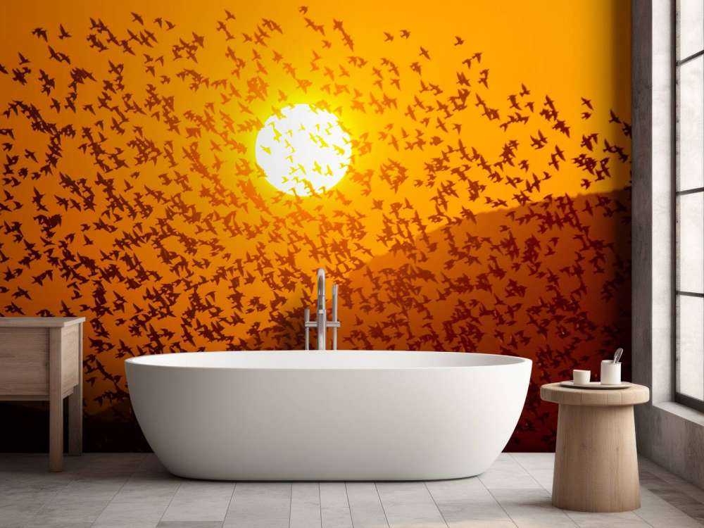 Grote groep vogels bij zonsondergang