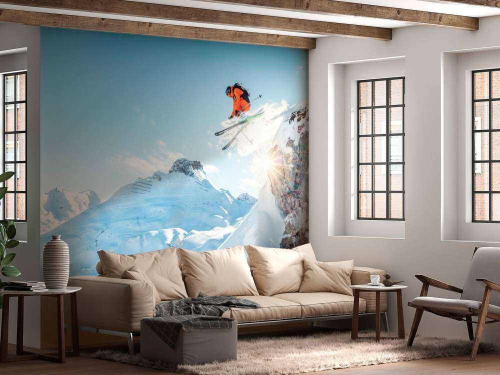 Sprong in besneeuwd berglandschap