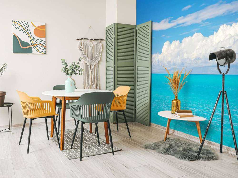 Panoramic view of a blue seascape with sailboat and cloudy sky
