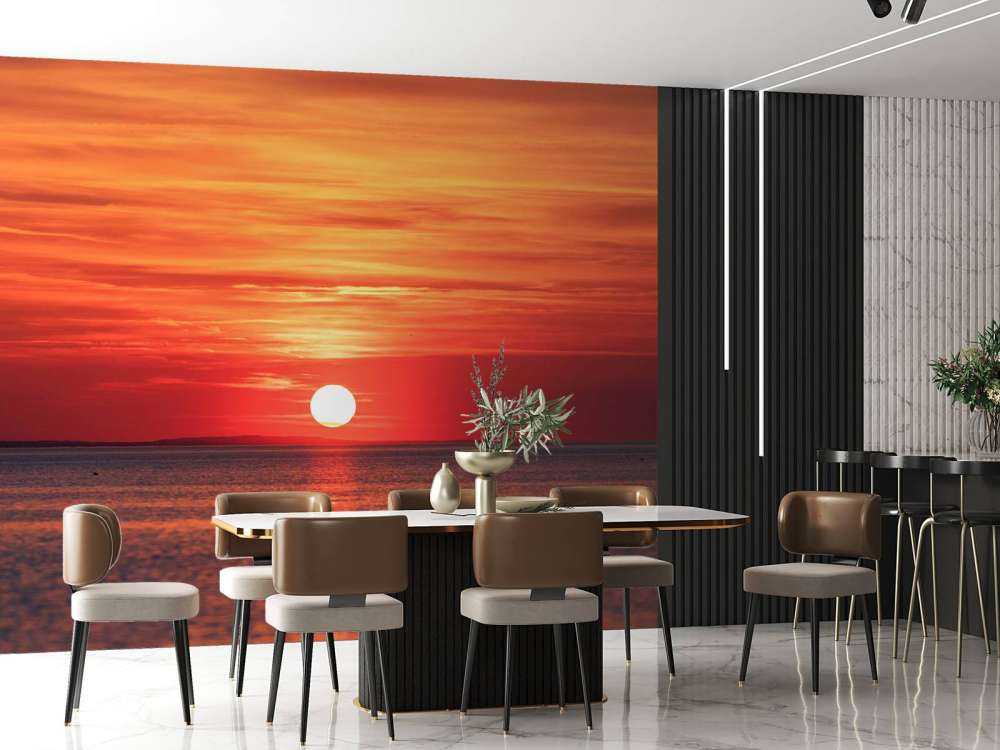 Vuurrode zonsondergang boven kalme zee