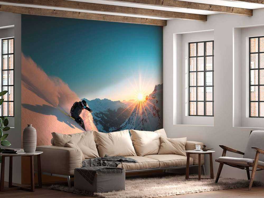 Sneeuwafdaling bij vurige zonsondergang