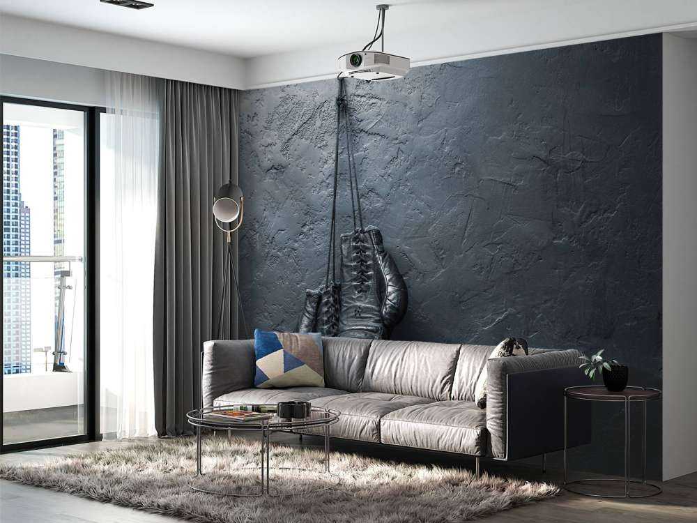 Old school zwarte bokshandschoenen aan een donkere muur