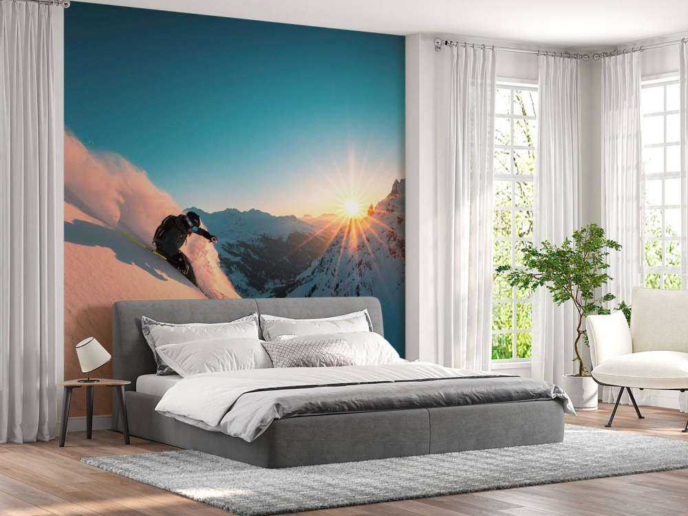 Sneeuwafdaling bij vurige zonsondergang