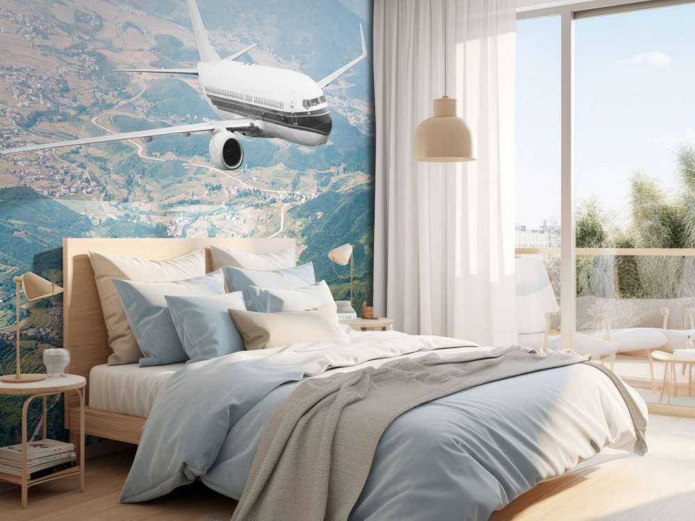 Passagiersvliegtuig boven een berglandschap