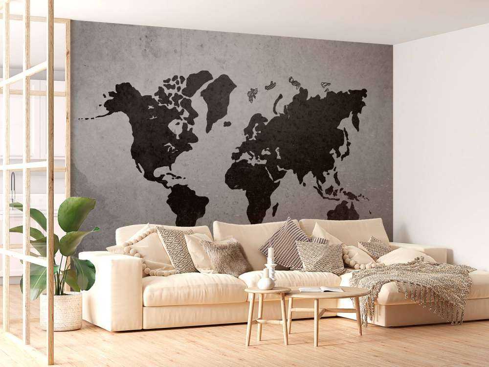 Zwarte wereldkaart op een betonnen muur