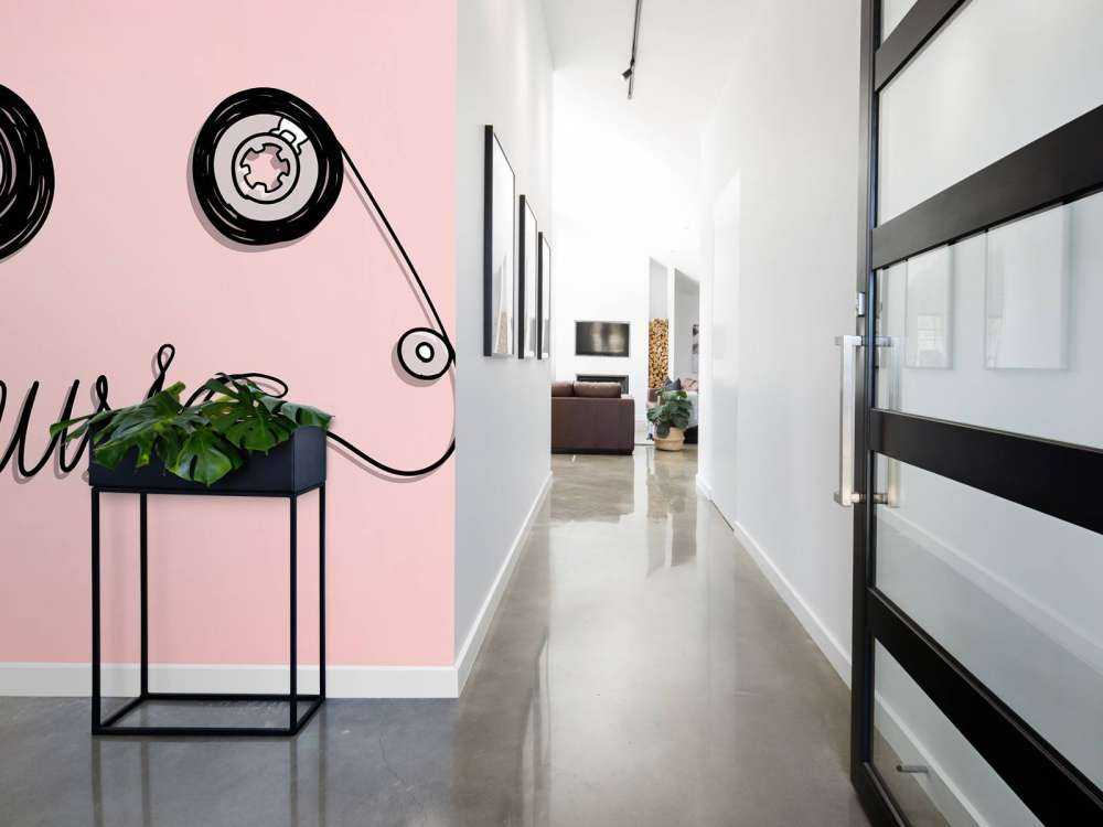 Cassettebandje met een roze achtergrond