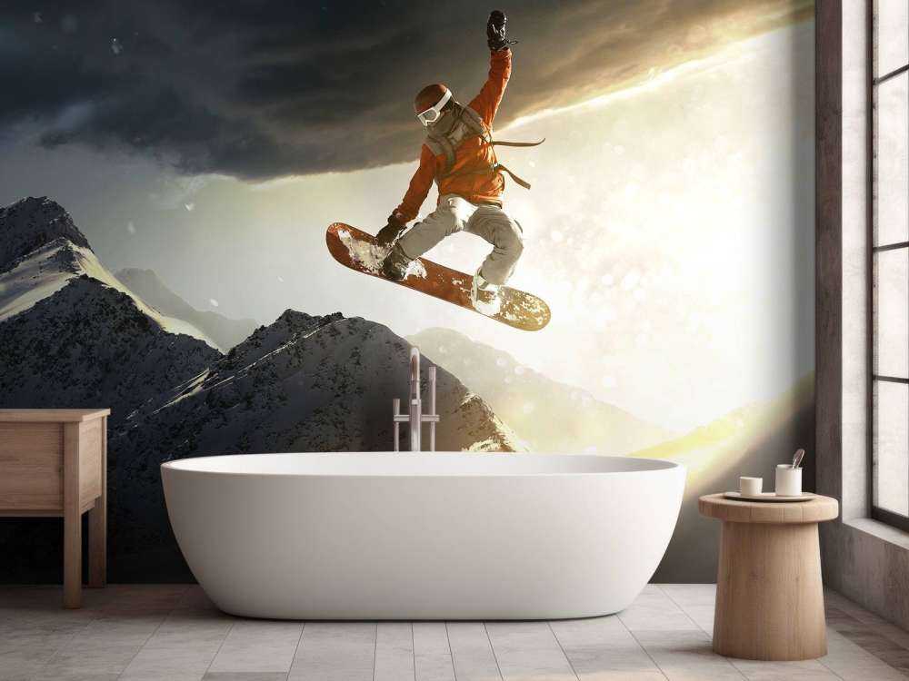 Snowboarder maakt een sprong bij zonsondergang