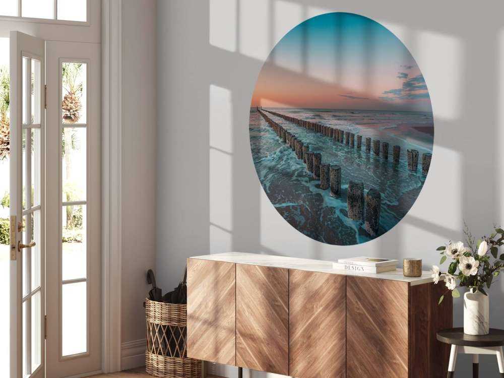 Golfbrekers bij zonsondergang