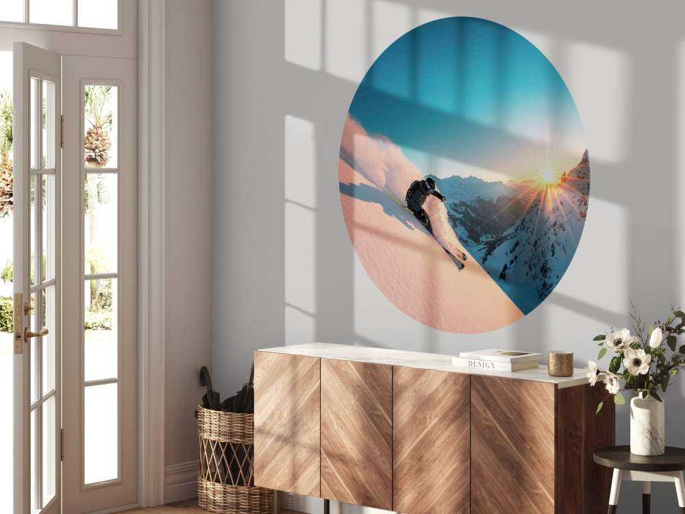 Sneeuwafdaling bij vurige zonsondergang