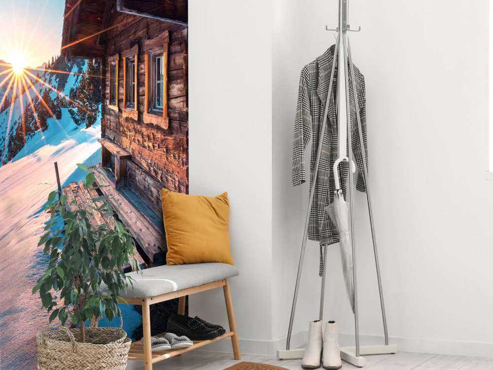 Ochtendlucht bij houten alpenhut