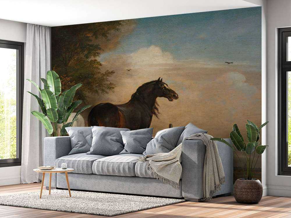 Twee paarden in de weide bij een hek