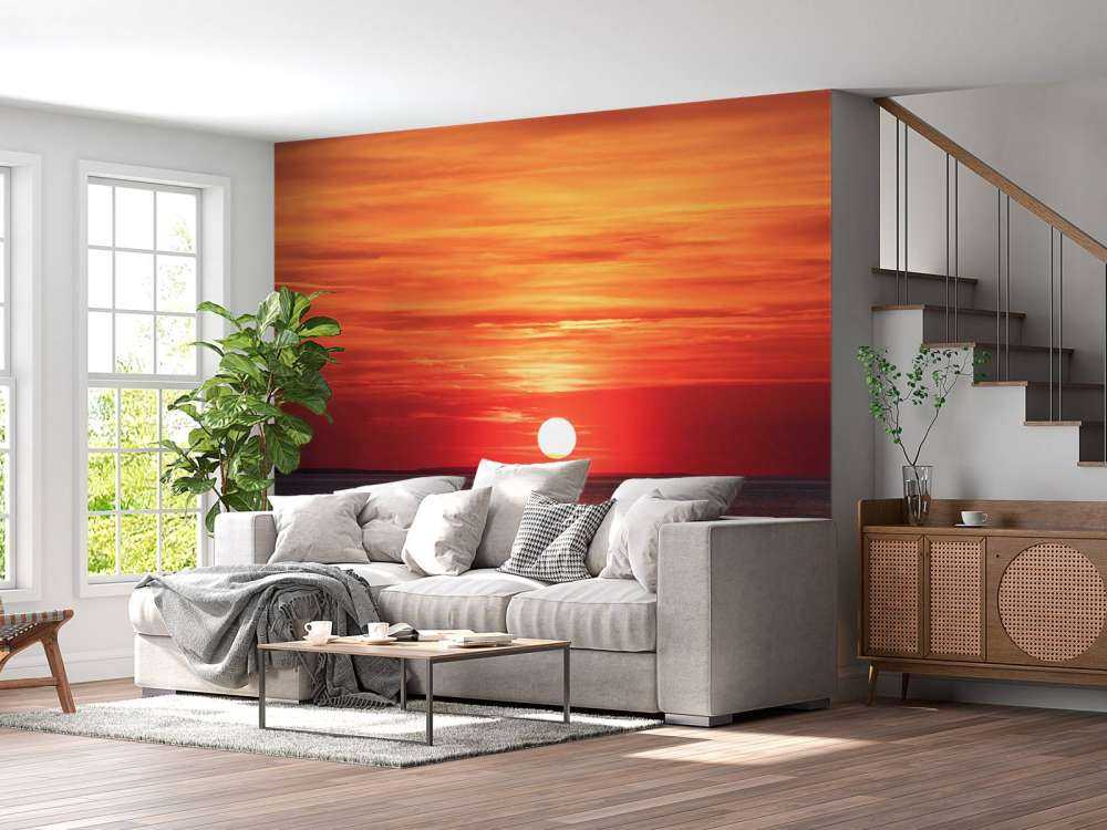 Vuurrode zonsondergang boven kalme zee