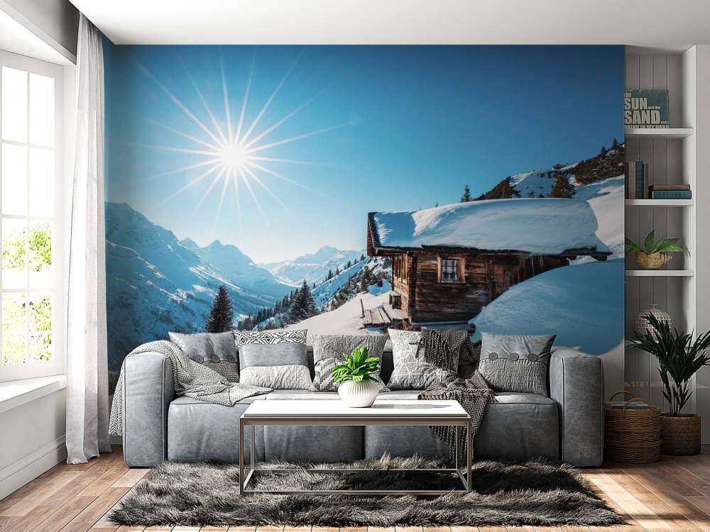 Winterzon boven houten berghut