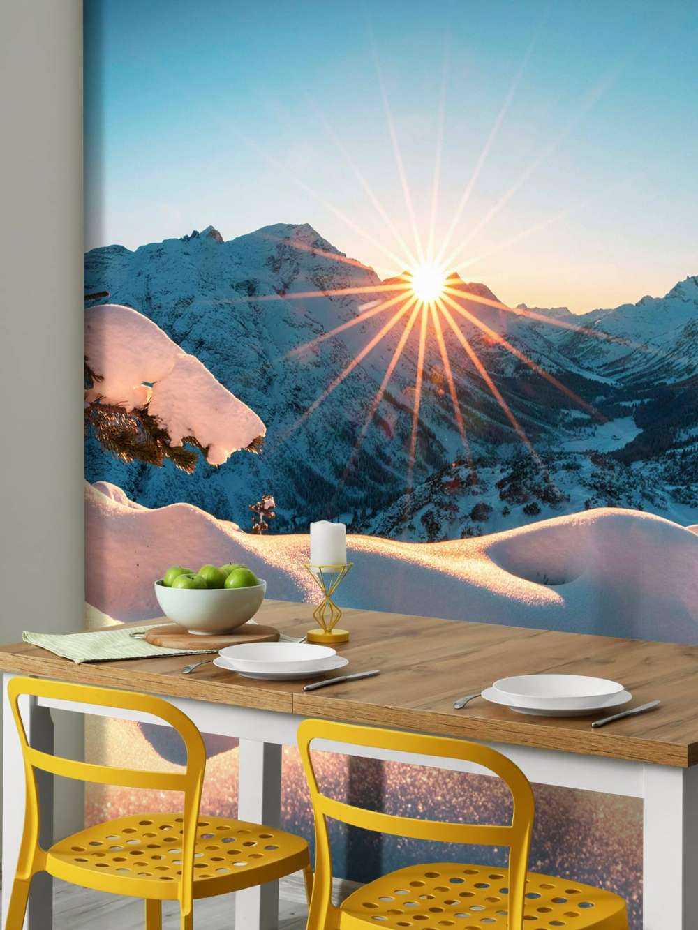 Ochtendzon over besneeuwd dal