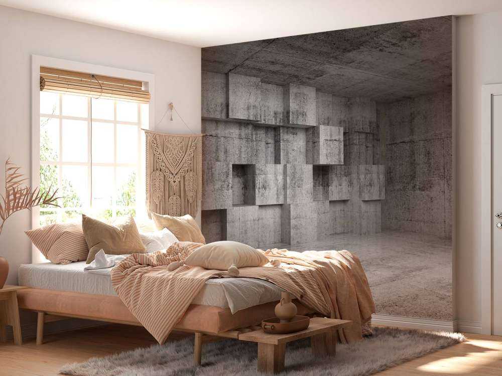 Lege betonnen interieur met decoratie kubussen op de muur